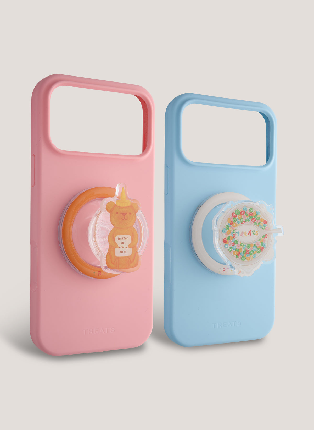 Pink and blue phone case with cartoon character designs on a light grey background
