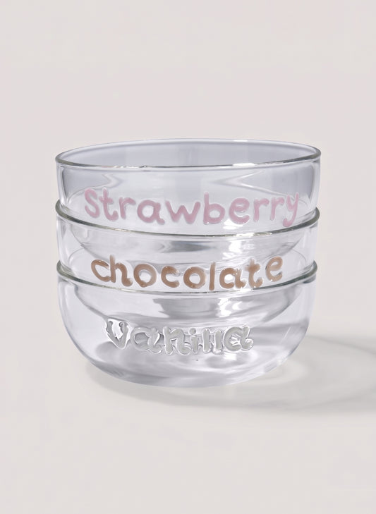 Clear glass dessert bowl with 'Strawberry chocolate' text and 'vanilla' writting on a light background