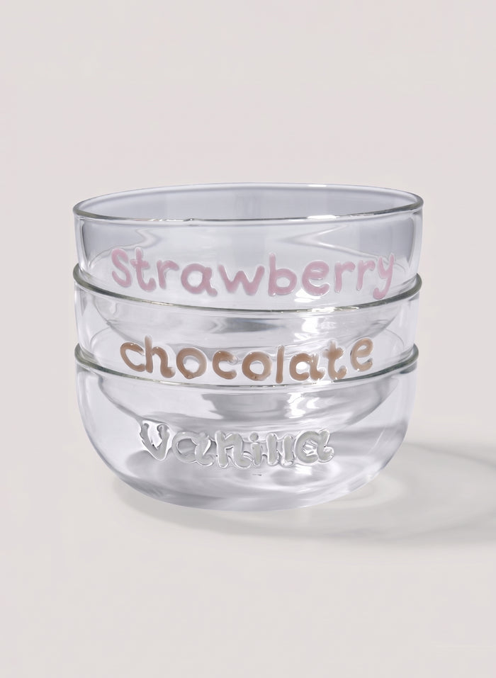 Clear glass dessert bowl with 'Strawberry chocolate' text and 'vanilla' writting on a light background