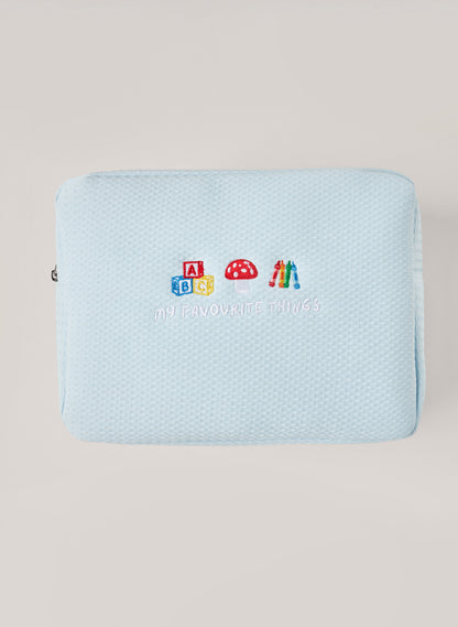 Light blue waffle-textured pouch with zipper closure, featuring a red embroidered heart and the words 'personalise me’ on the front