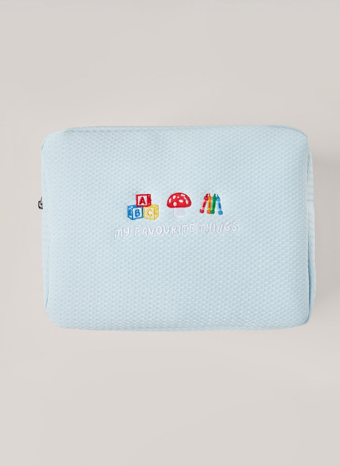 Light blue waffle-textured pouch with zipper closure, featuring a red embroidered heart and the words 'personalise me’ on the front