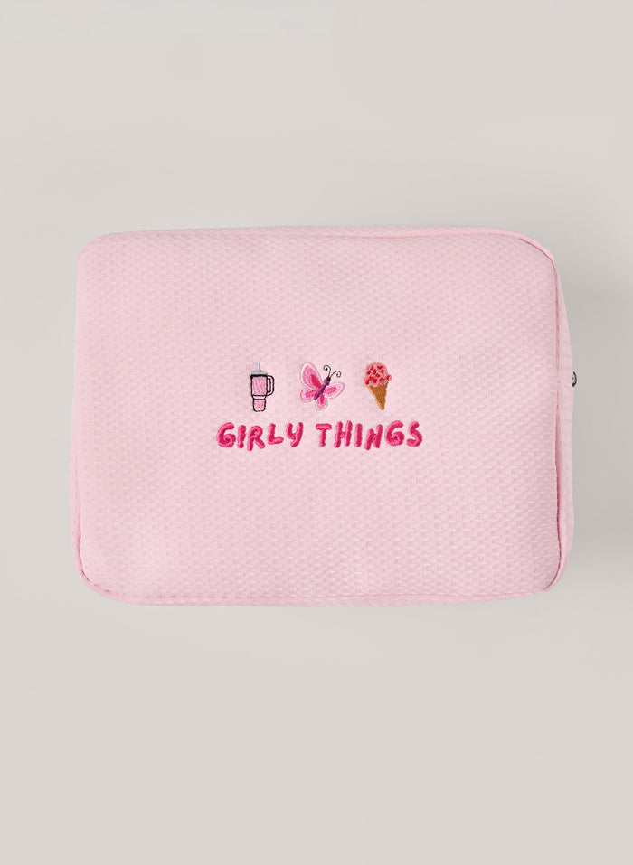 Light pink waffle-textured pouch with zipper closure, featuring a red embroidered heart and the words 'personalise me’ on the front