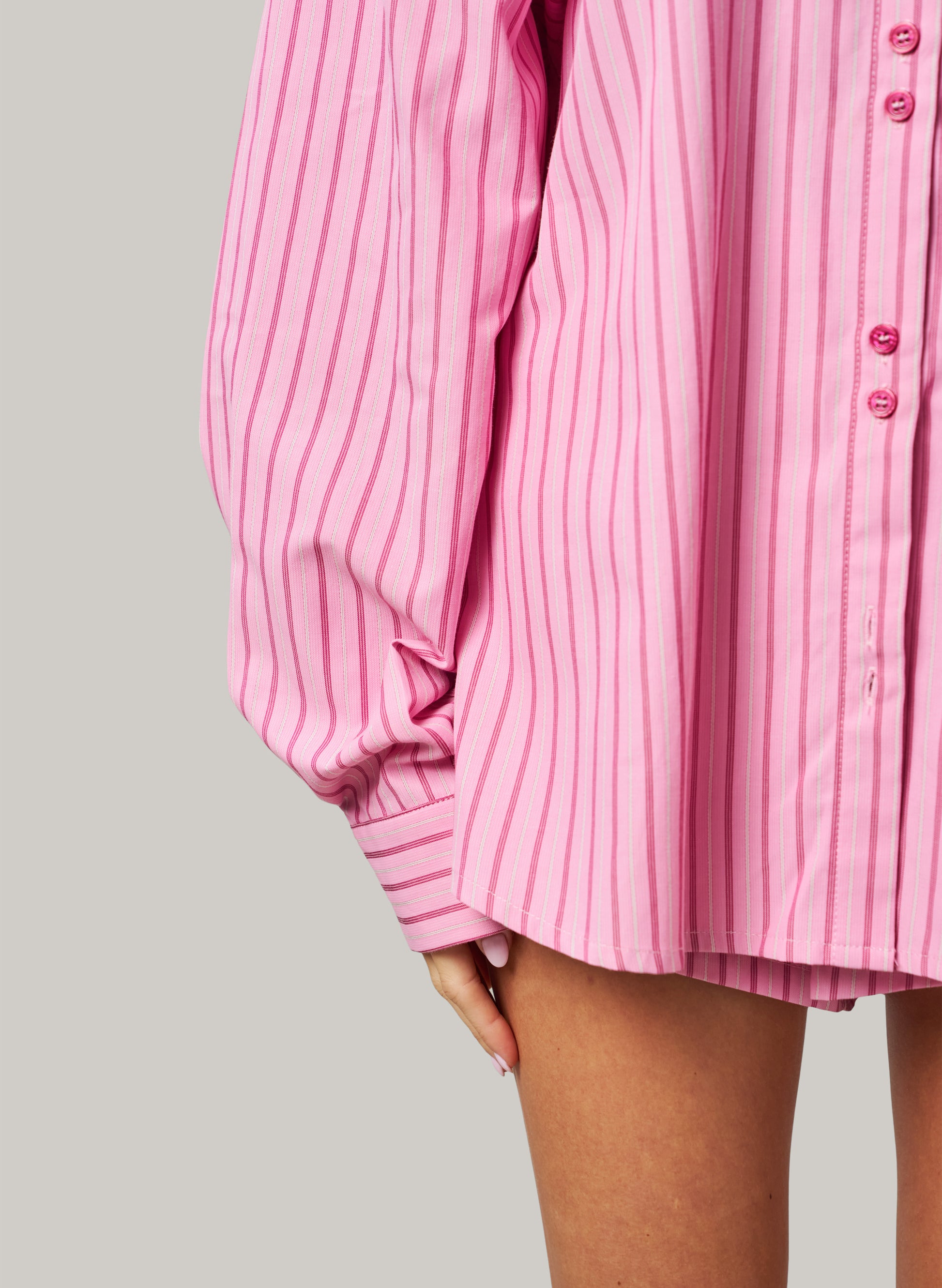 Pink striped shirt on a gray background