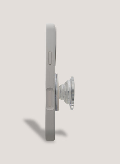 Phone case with a pop socket on a light gray background