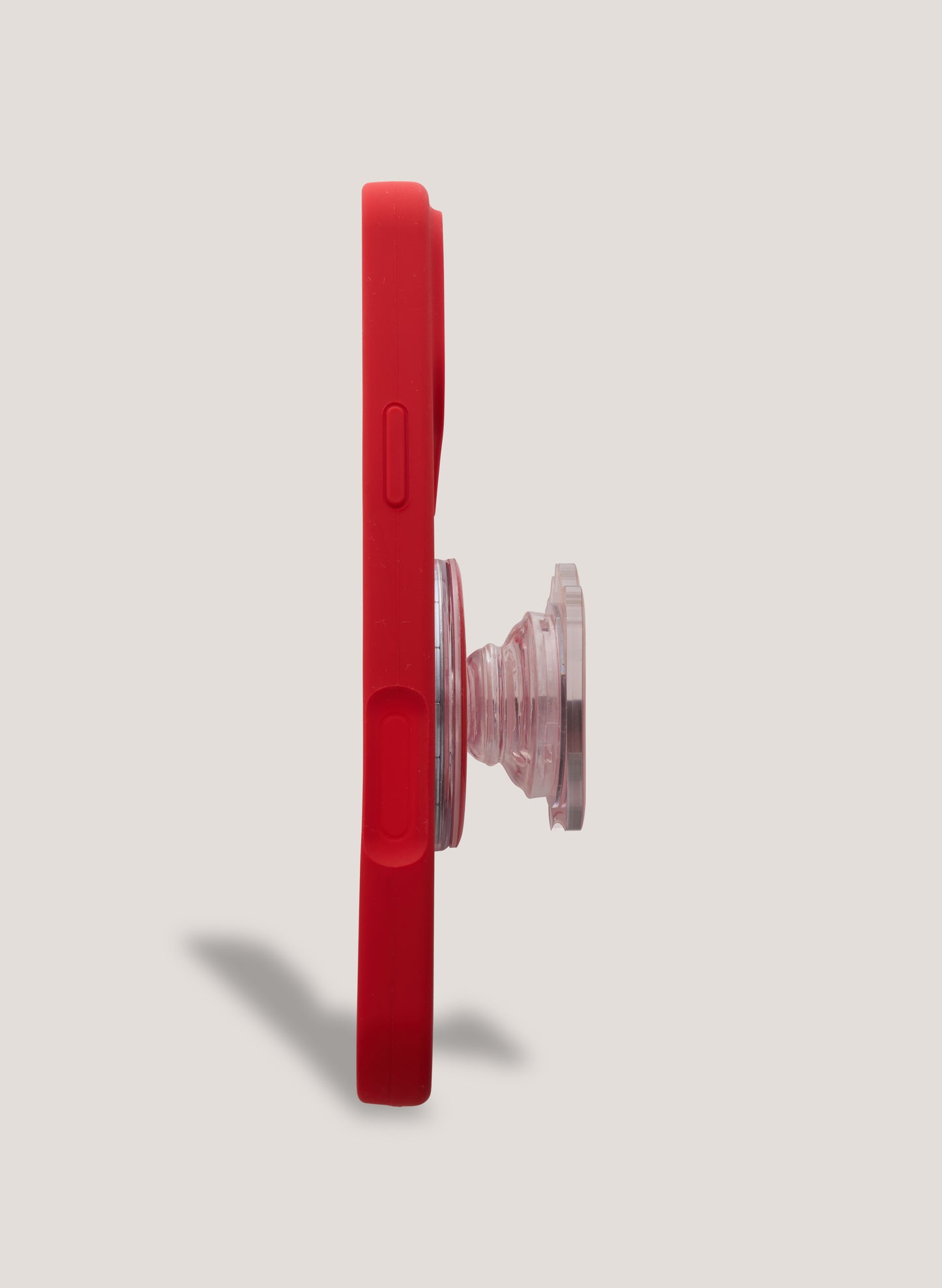 Red phone case with a clear pop socket on a light gray background