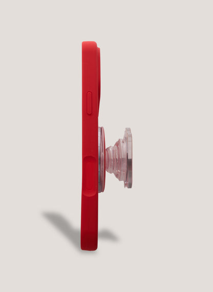 Red phone case with a clear pop socket on a light gray background