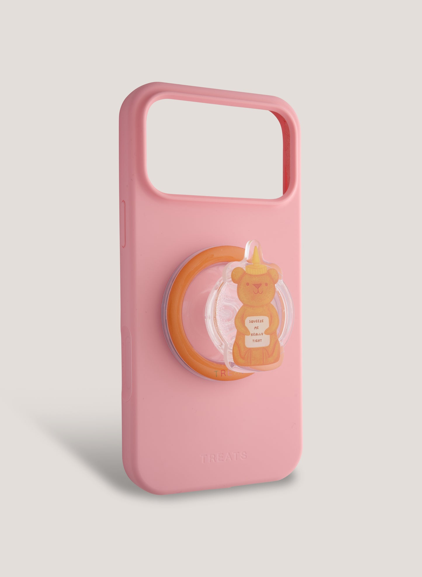 Pink phone case with a bear design on a light grey background