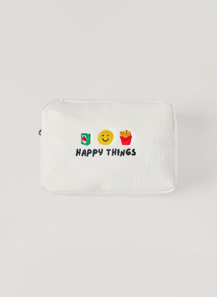 White waffle-textured pouch with zipper closure, featuring embroidered drink, smiley face, and fries icons with ‘happy things’ text on the front