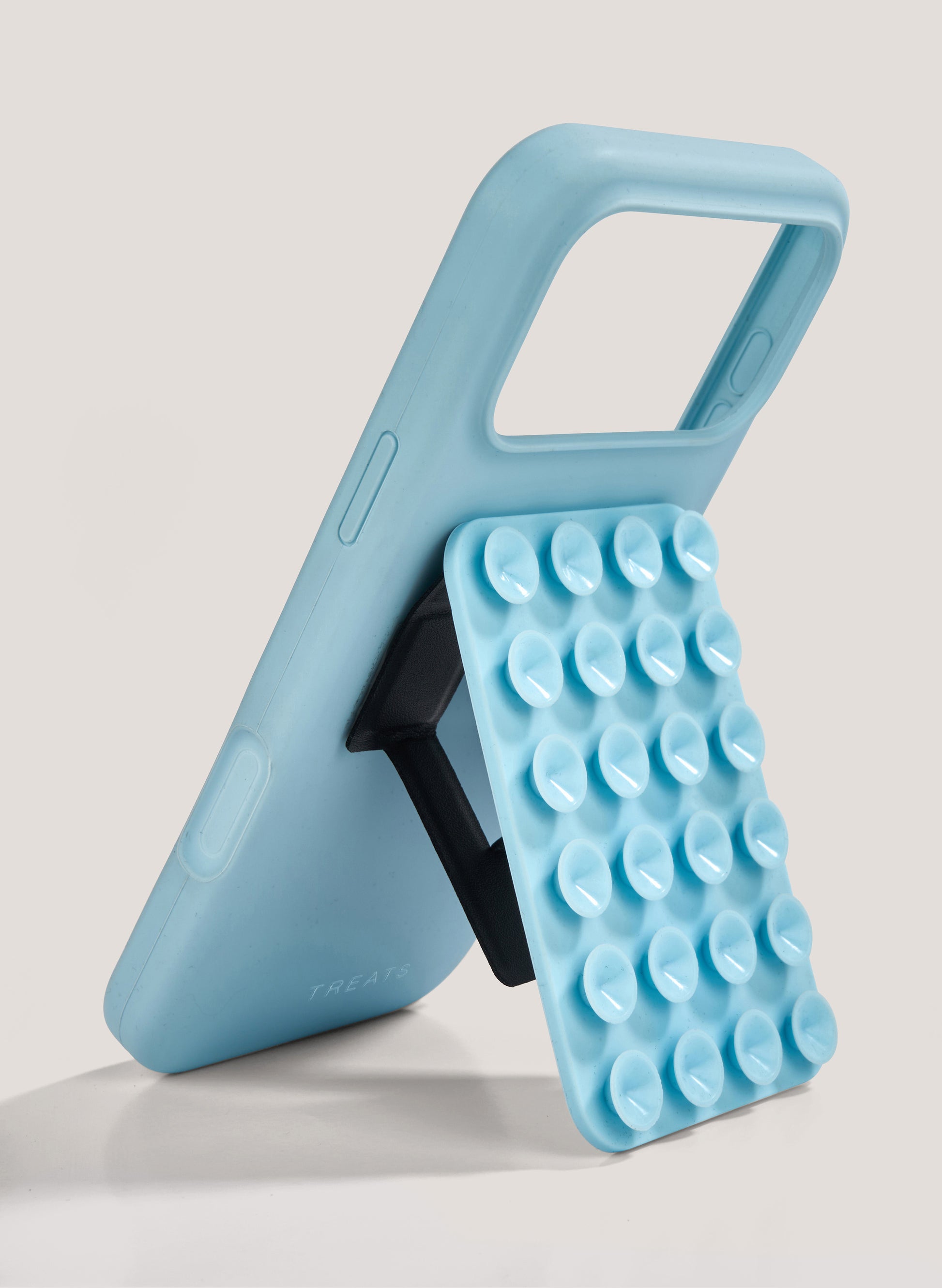 Blue phone case with bubble texture and handle on a light gray background