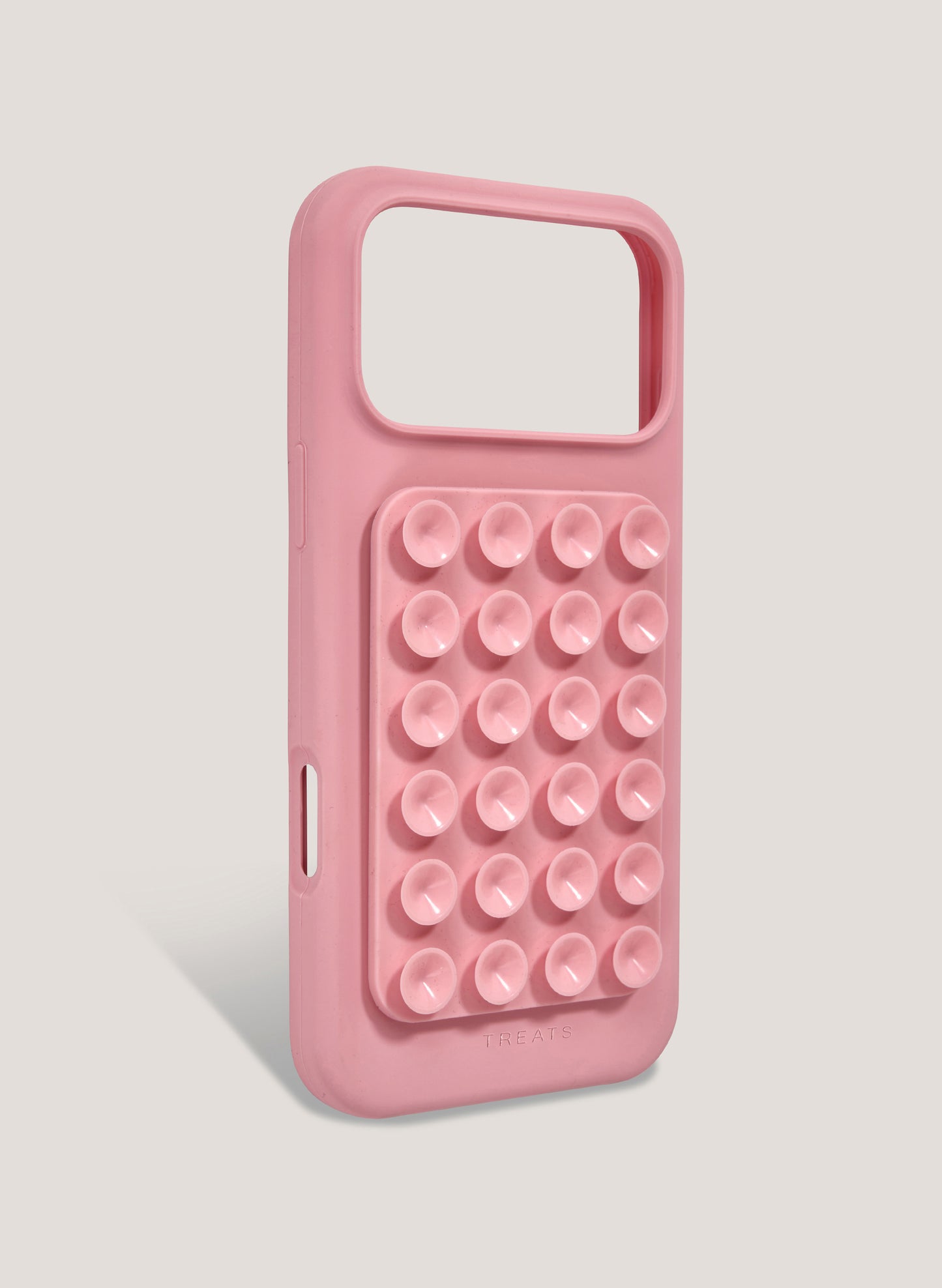 Pink phone case with bubble design on a light gray background