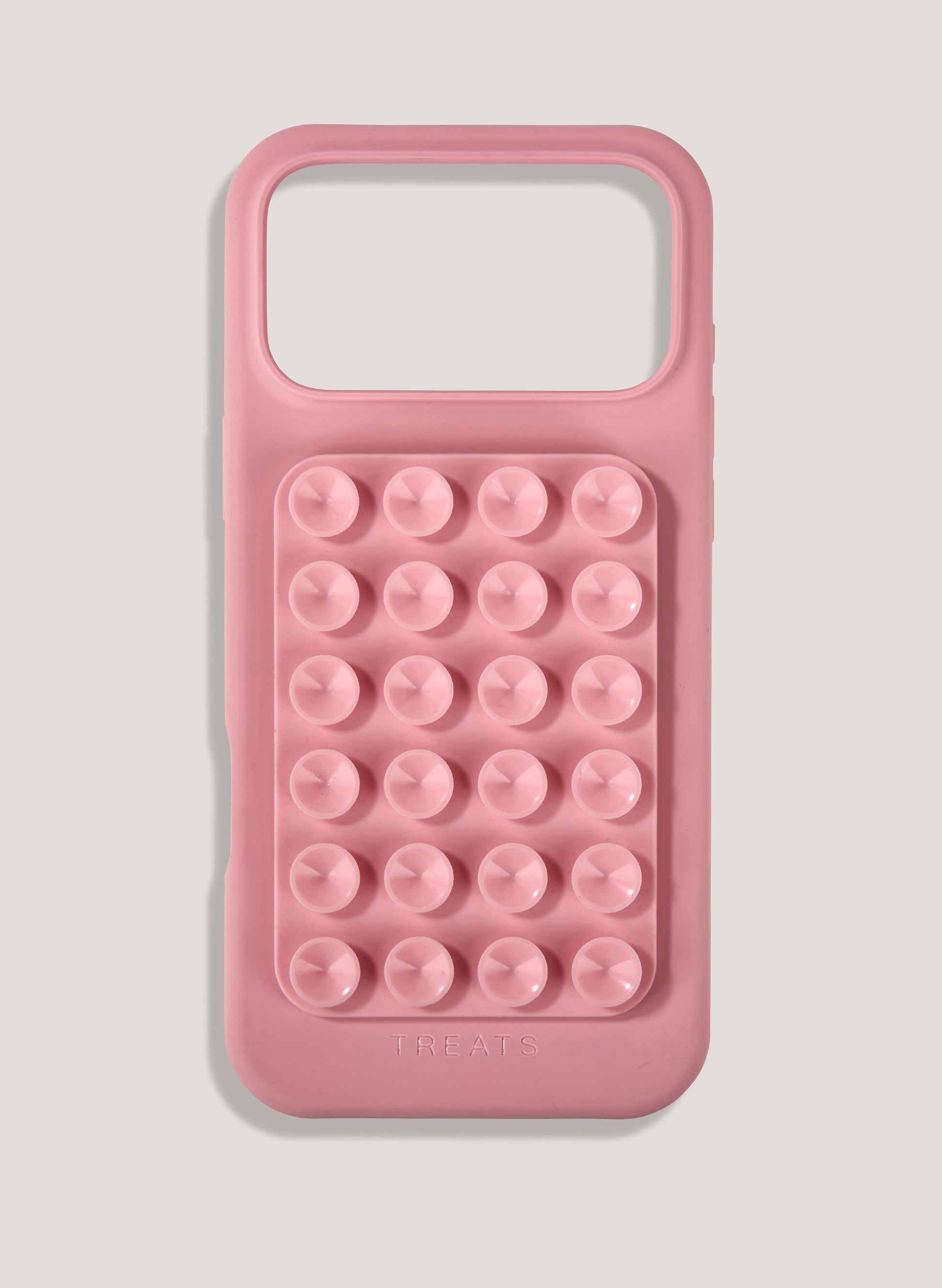 Pink phone case with bubble design on a light gray background
