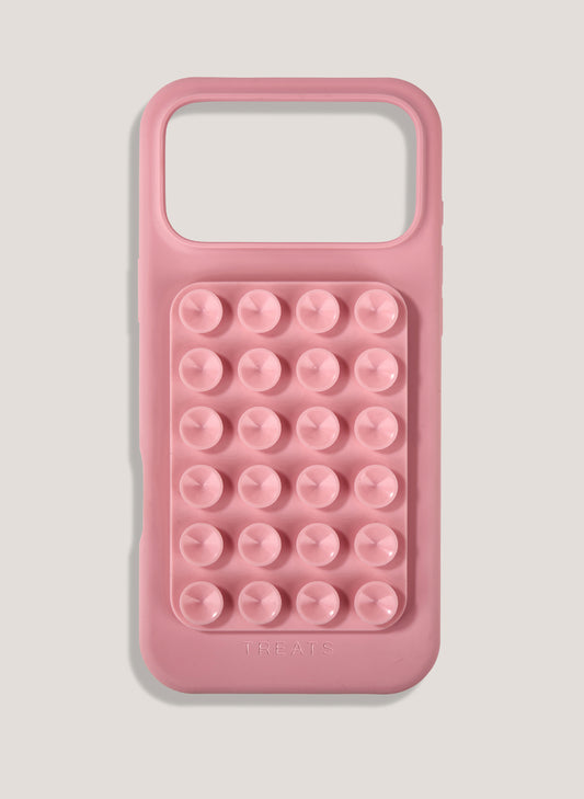 Pink phone case with bubble design on a light gray background
