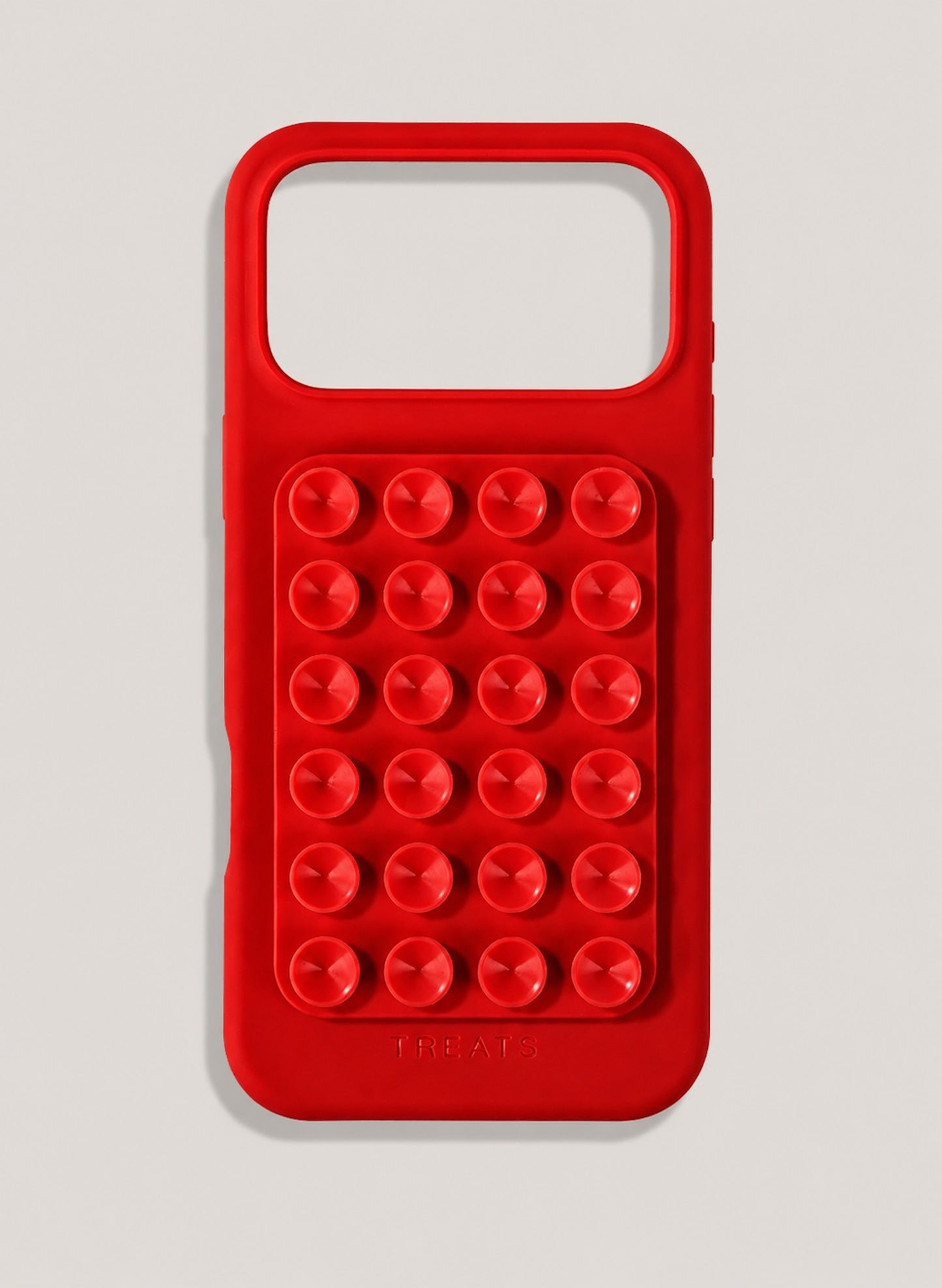 Red phone case with suction cups on a light grey background