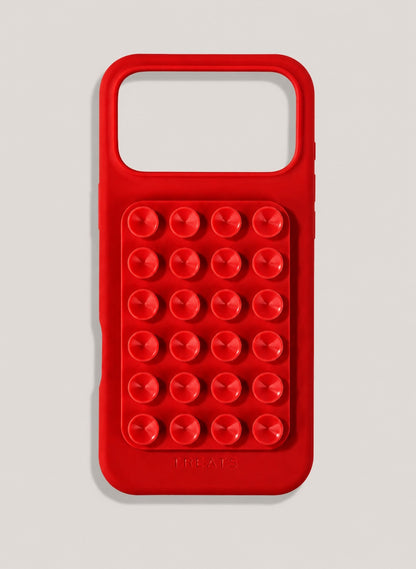 Red phone case with suction cups on a light grey background