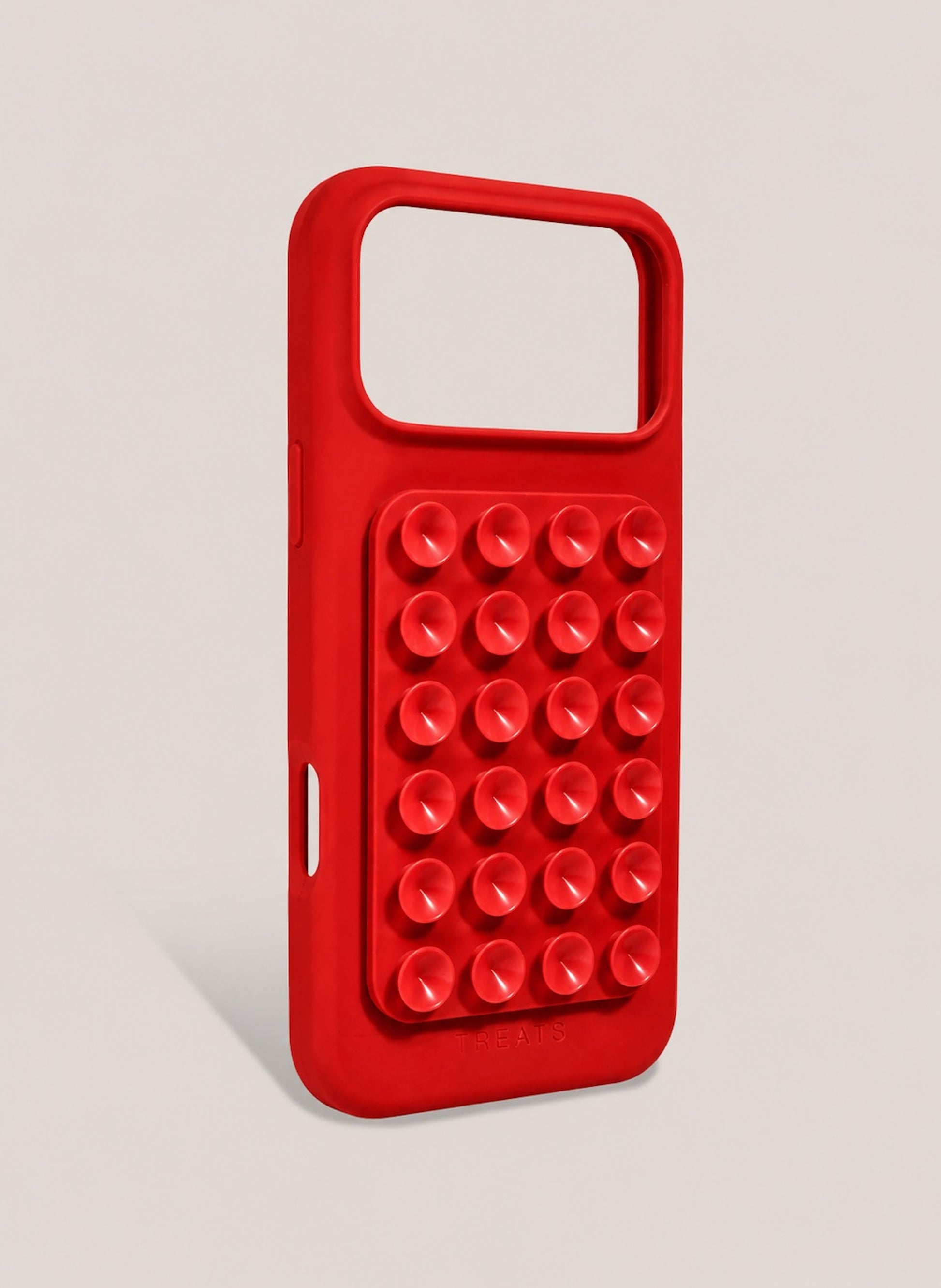 Red phone case with suction cups on a light grey background