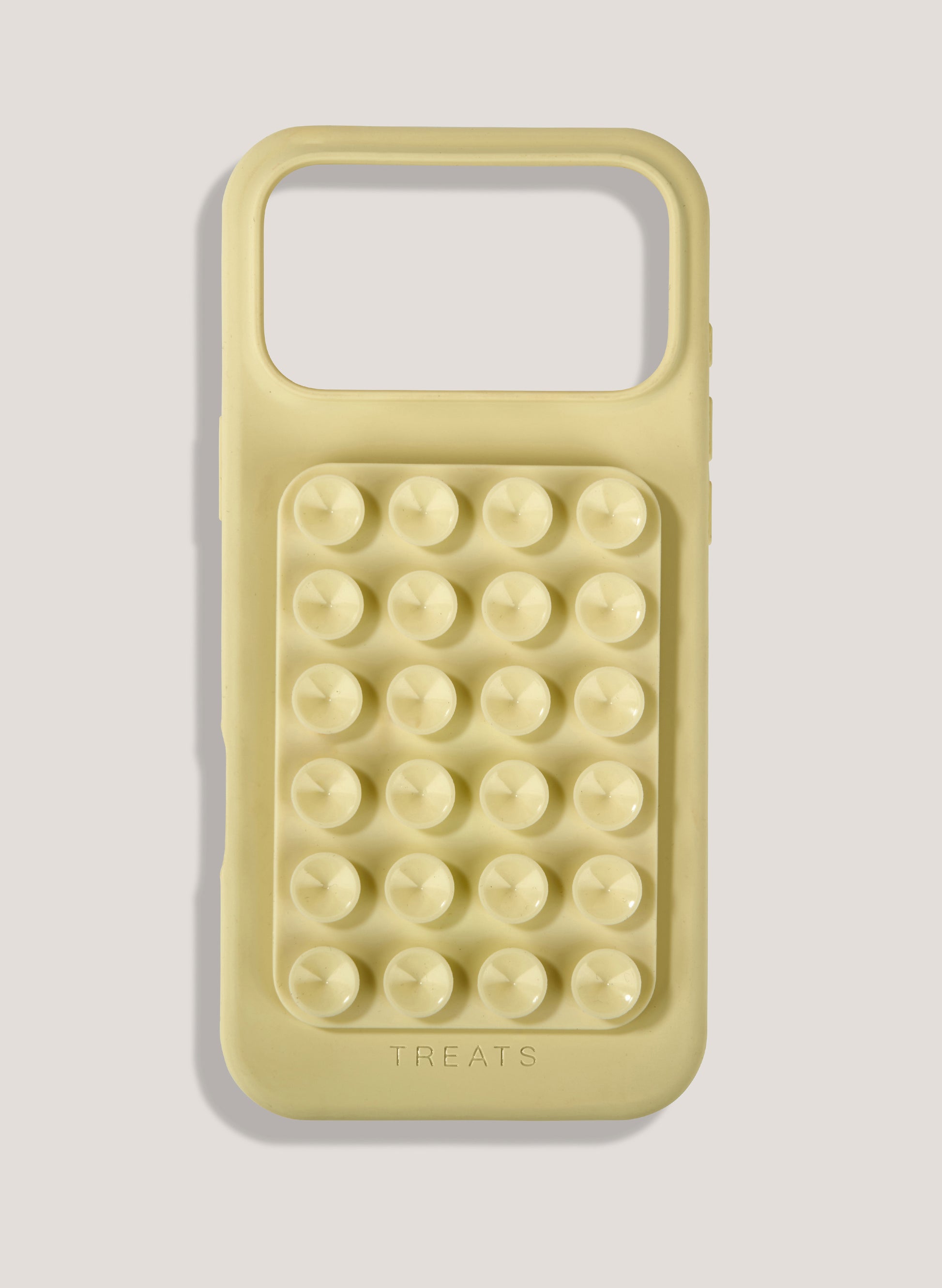 Yellow phone case with bubble texture on a light gray background