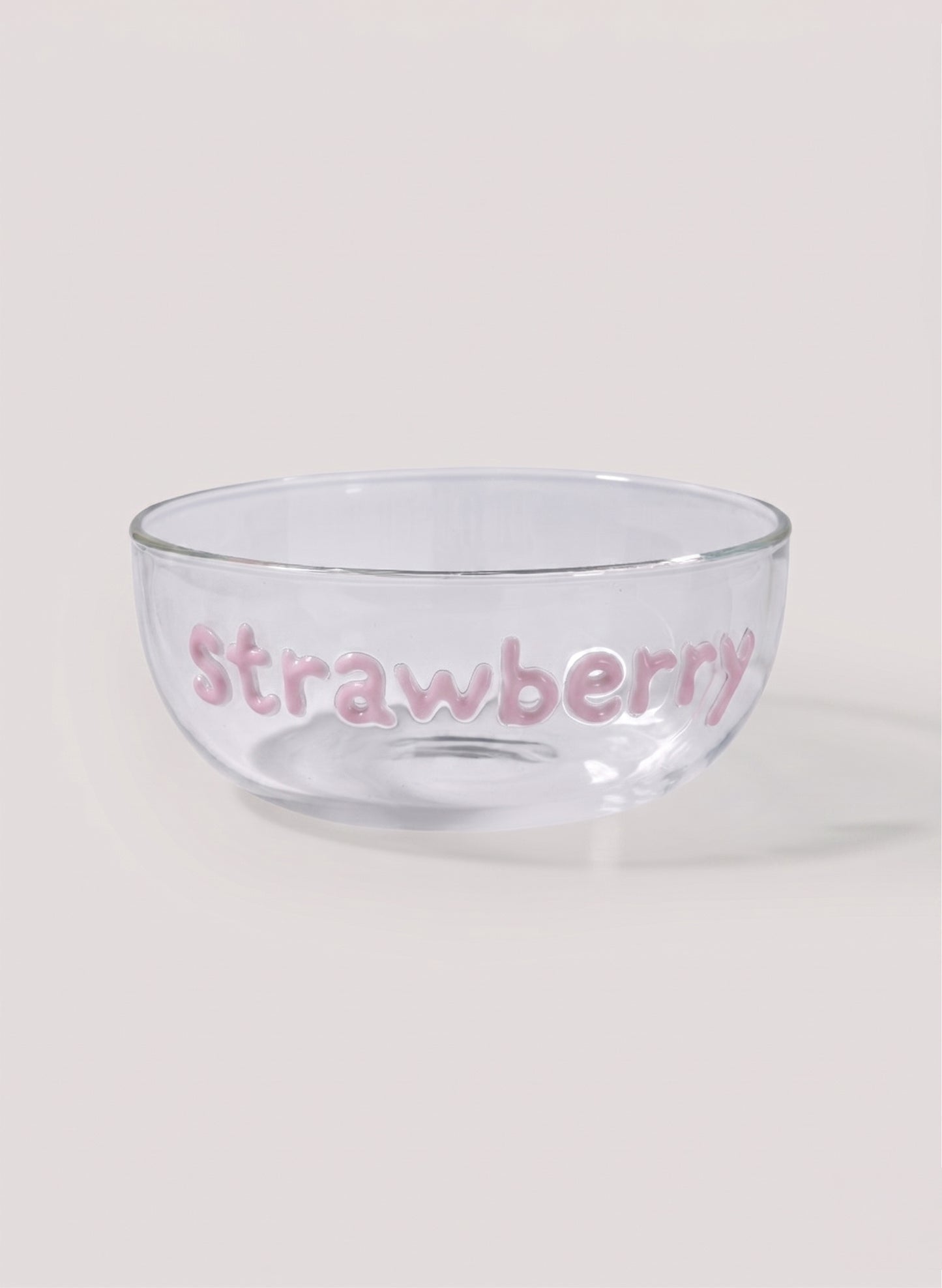 Clear glass bowl with 'Strawberry' text on a white background