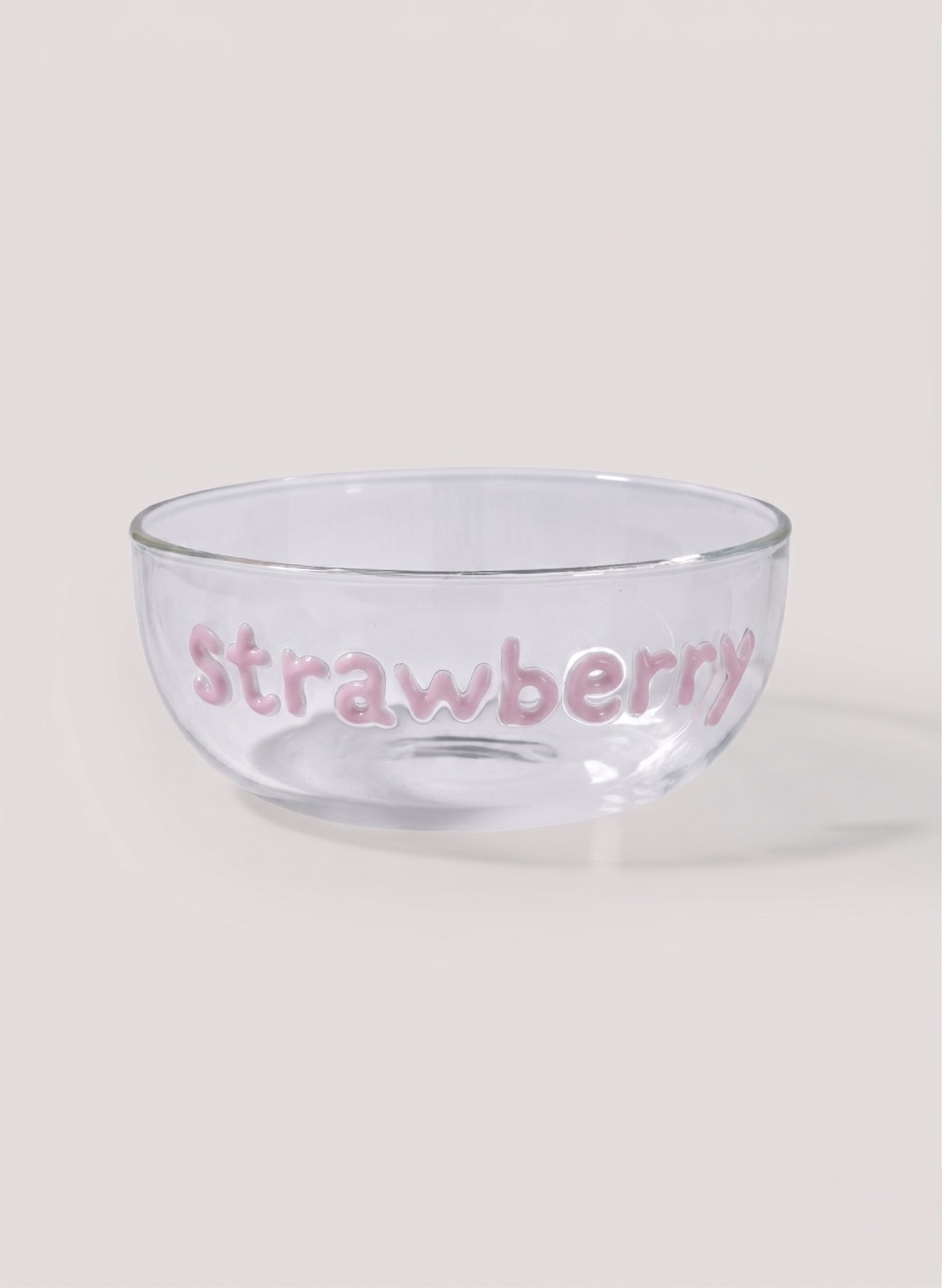 Clear glass bowl with 'Strawberry' text on a white background