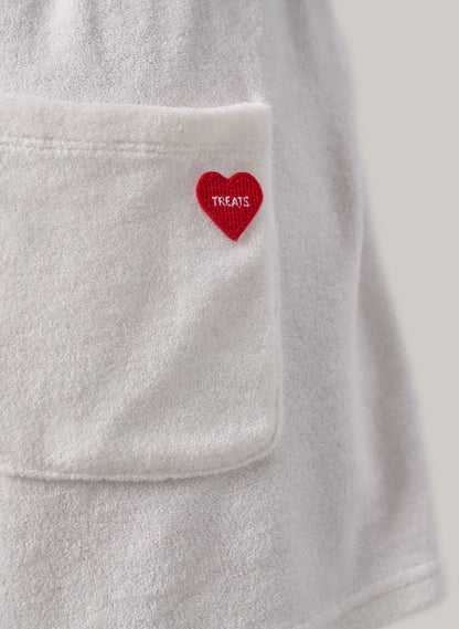 Grey Towel jacket with a red heart patch labeled 'TREATS' on a light grey background