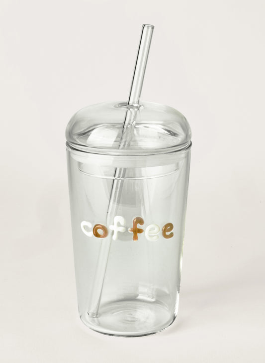 Clear tumbler with 'coffee' text and straw on a white background