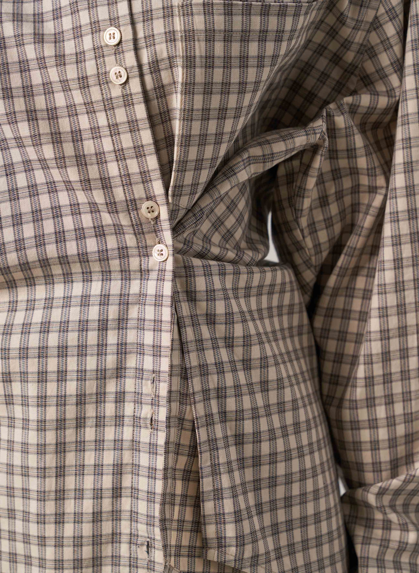Close-up of a plaid shirt with buttons