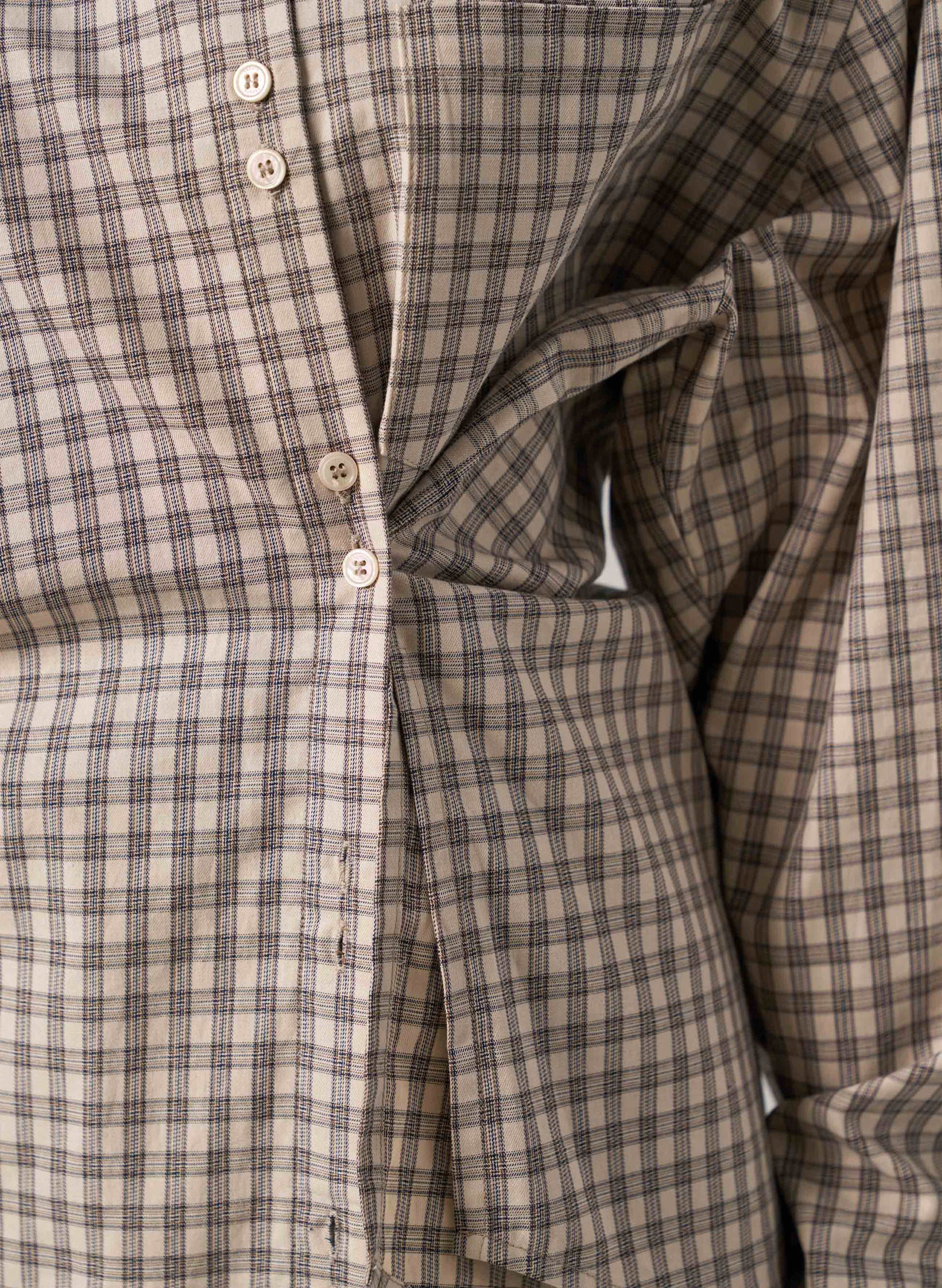 Close-up of a plaid shirt with buttons