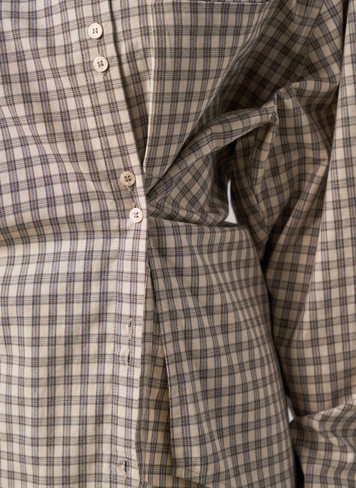 Close-up of a plaid shirt with buttons
