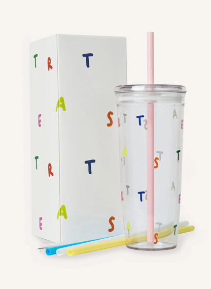 A clear tumbler with a pink straw against a solid off-white background.