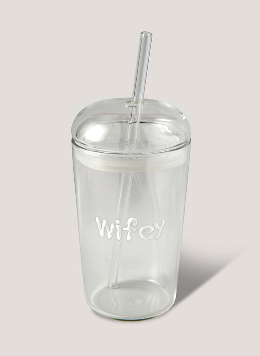 Clear tumbler with 'Wifey' text and straw on a light grey background