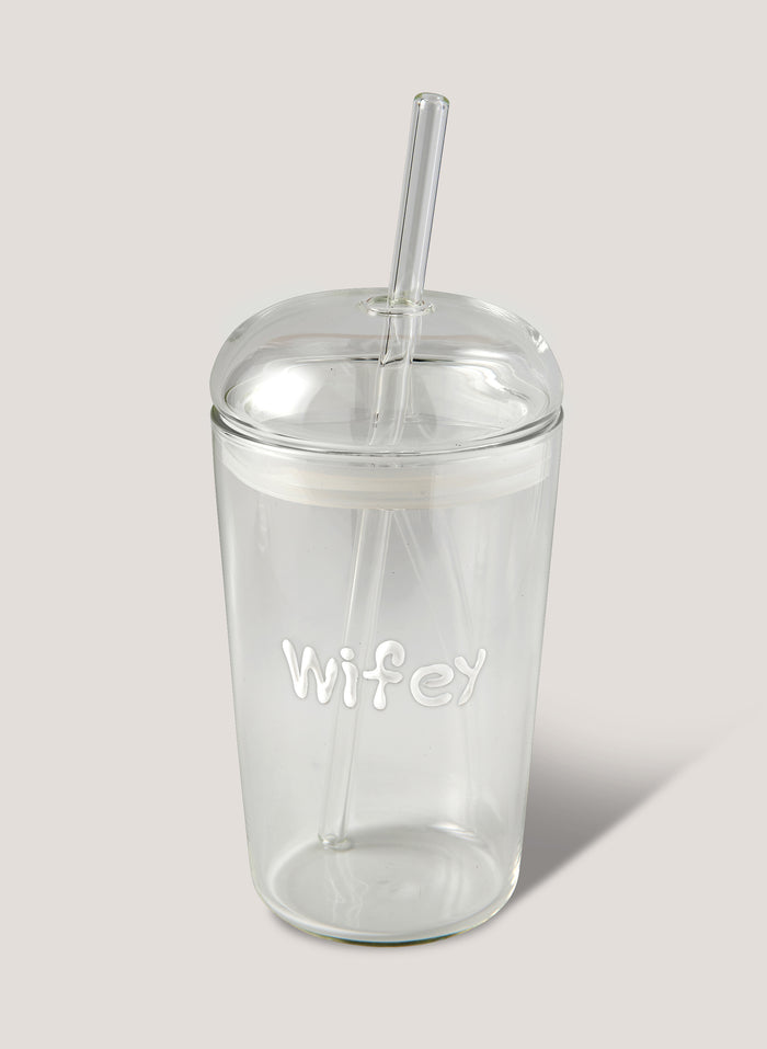 Clear tumbler with 'Wifey' text and straw on a light grey background